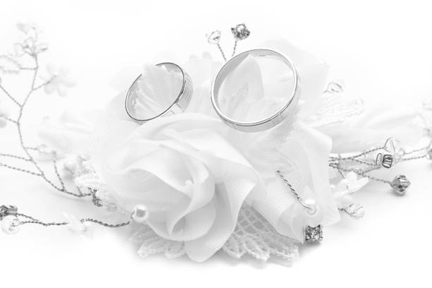 istock Wedding rings on wedding card, on a white wedding dress 1091403506