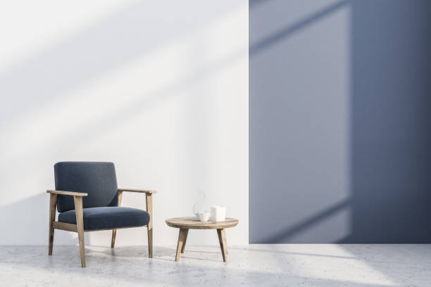 istock Blue and white room, gray armchair, table 1091404490