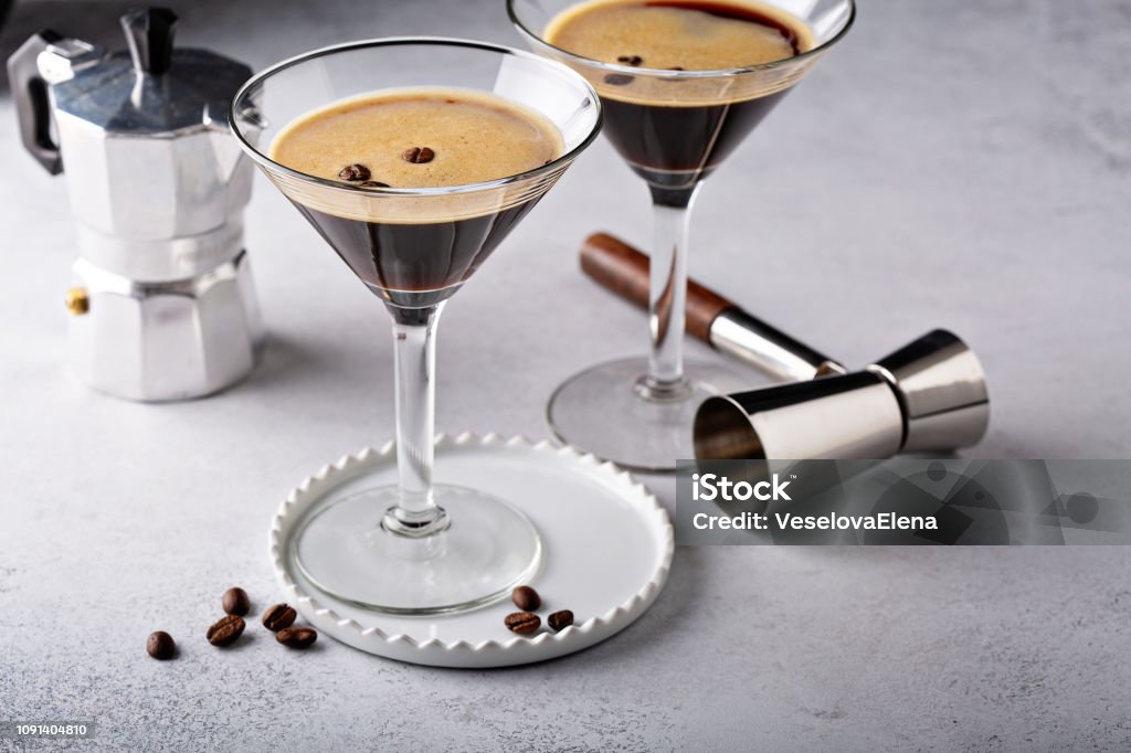 Espresso martini in two glasses Espresso martini in two glasses, coffee cocktail concept Martini Stock Photo