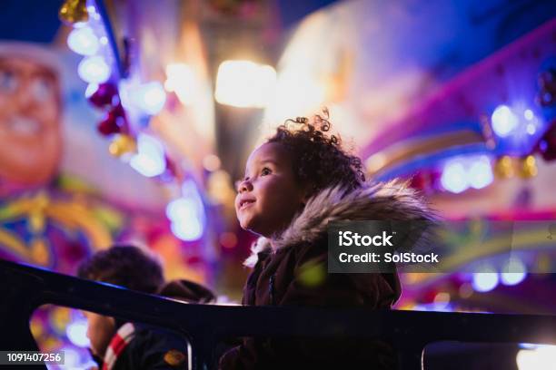 First Time At The Funfair Stock Photo - Download Image Now - Amusement Park, Christmas, Traveling Carnival