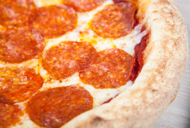 istock fresh hot pepperoni pizza with sausage close up 1091410222