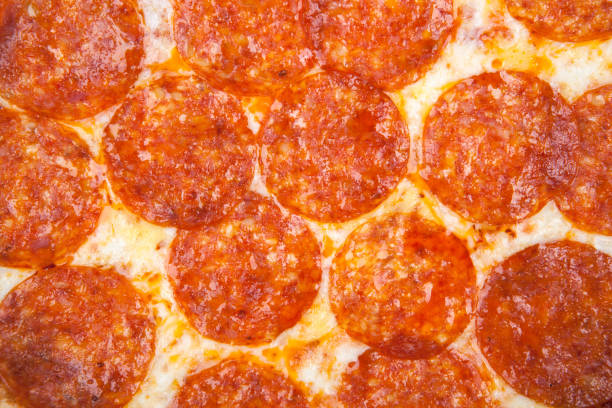 istock fresh hot pepperoni pizza with sausage close up background 1091410278