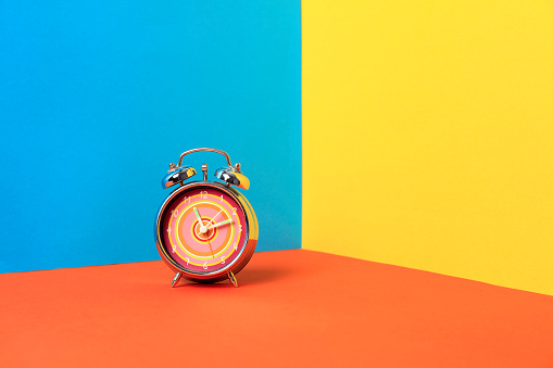 Alarm clock on a color background