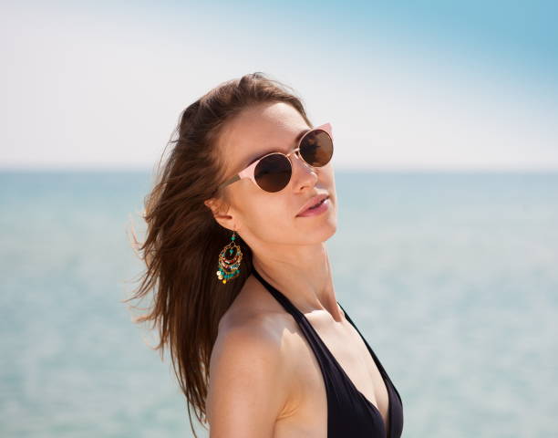 istock Sea. Face, sunglasses, earrings, close up 1091415846