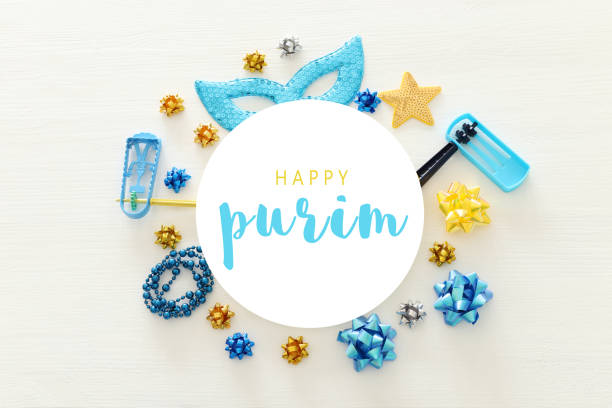 istock Purim celebration concept (jewish carnival holiday) over wooden white background. 1091418466