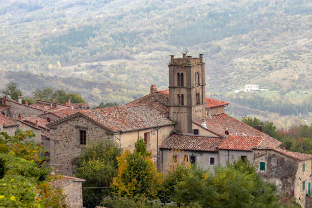These aerial views capture the dramatic landscape of Orte, a historic hilltop town in the Lazio region of central Italy. The village is built directly atop volcanic cliffs, with rustic stone houses appearing to emerge from the rock itself. Notable is the presence of ancient aqueducts and arched structures that stretch across the surrounding valley, integrating Roman engineering with natural terrain. The lush greenery, rural surroundings, and overcast sky further emphasize the village’s secluded and timeless charm. Orte is an ideal example of Italy’s architectural resilience and cultural depth, offering inspiration for concepts related to history, solitude, and scenic travel.