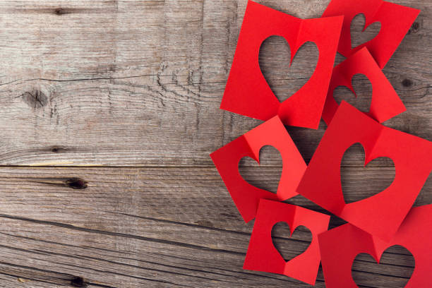 istock Hearts on wooden background 1091419732