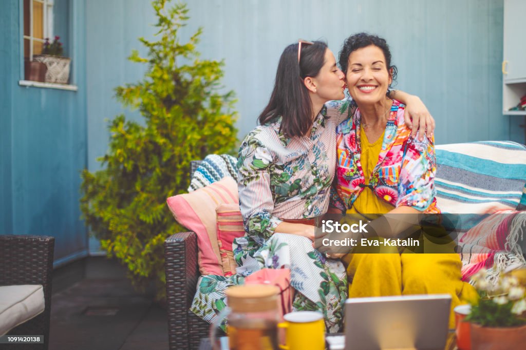 Mother and daughter are embracing each other Mother's Day Stock Photo