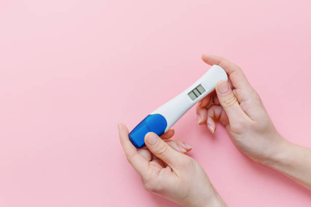 istock Woman shows positive pregancy test 1091422622