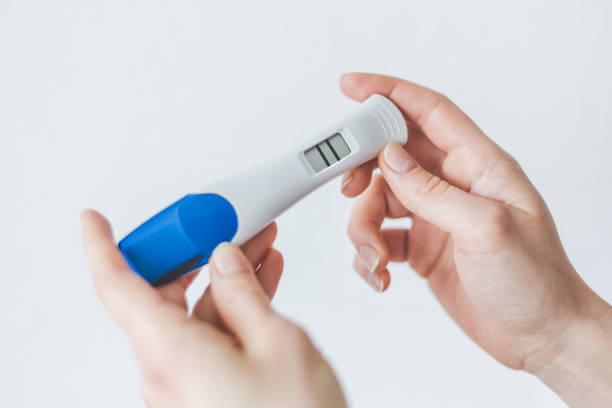 istock Woman shows positive pregancy test 1091422654