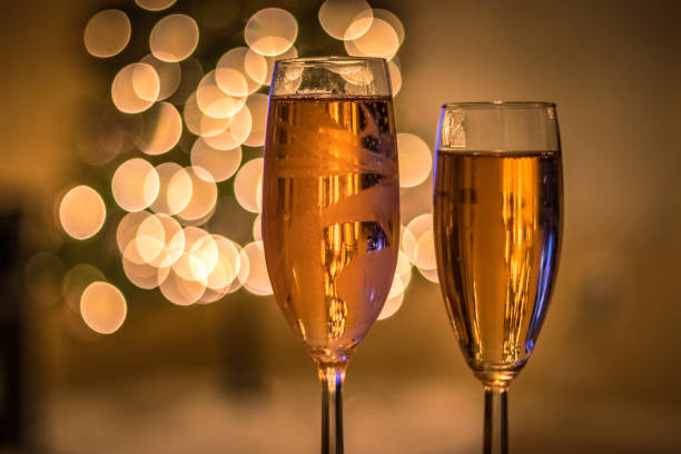 istock Champagne glasses in front of Christmas tree 1091423100