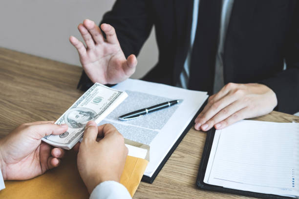 istock Anti bribery and corruption concept, Business man refusing and don't receive money banknote offered from business people to accept agreement contract of investment deal 1091423722