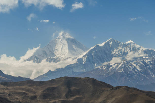 istock Nepal - Himalayan mountains and a brown hill 1091427182