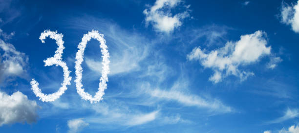 istock Number 30 on a blue background with clouds 1091429452