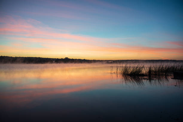 istock colorful misty sunset on the river in summer 1091430602