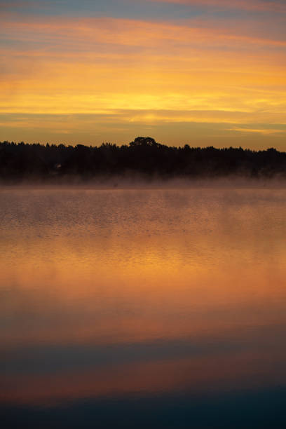 istock colorful misty sunset on the river in summer 1091430618