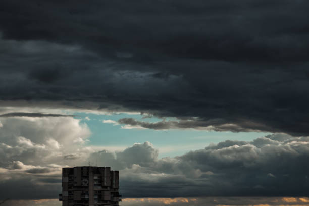 istock Dark, dramatic clouds, time before a storm, thundery fluffy clouds. Thunderstorm in the city. 1091431106