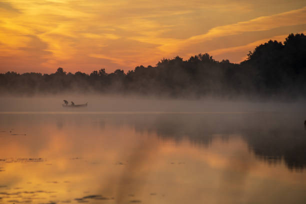 istock colorful misty sunset on the river in summer 1091432766