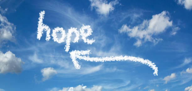 istock HOPE inscription with arrows on a blue sky with clouds 1091433572