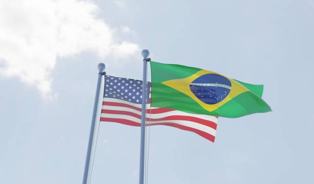 istock USA and Brazil, two flags waving against blue sky 1091438634