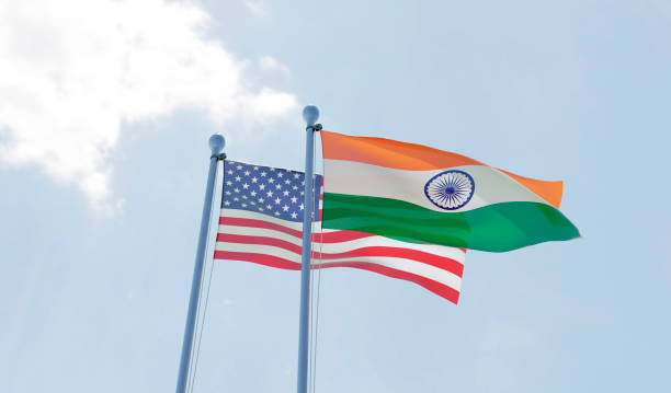 istock USA and India, two flags waving against blue sky 1091439016