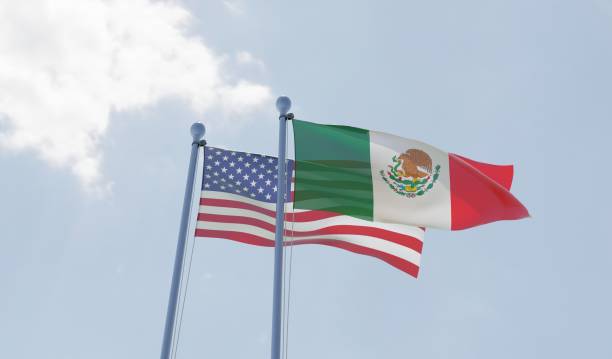 istock USA and Mexico, two flags waving against blue sky 1091439066