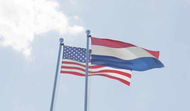 istock USA and Netherlands, two flags waving against blue sky 1091439072