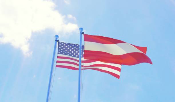 istock USA and Austria, two flags waving against blue sky 1091439206