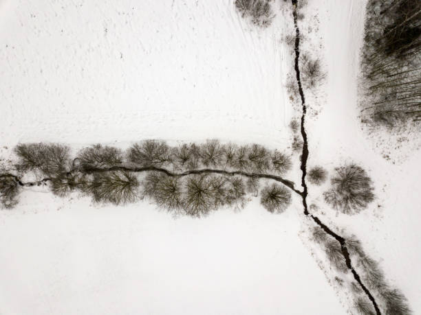 istock country small river in winter and bushes from above 1091444306