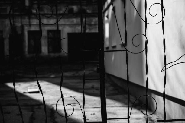 istock Old metal fence with a lock on it 1091448660