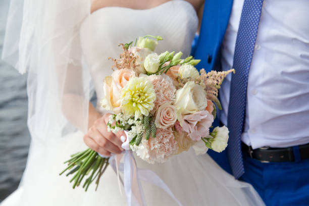 istock Wedding bouquet in the hands of the bride. 1091449324