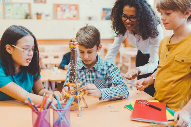 istock School children with mixed race teacher in class 1091451476