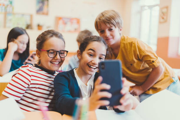 istock School children taking selfie in class 1091451624