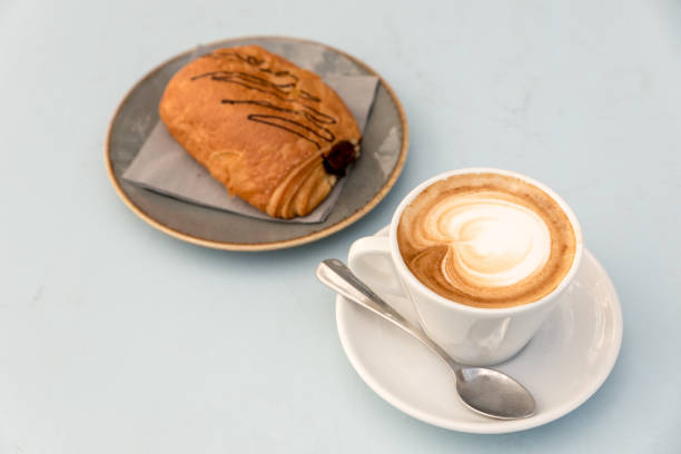 istock Breakfast at the beach with pasta and capuccino 1091451818