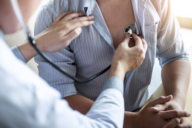istock Doctor using a stethoscope checking patient with examining, presenting results symptom and recommend treatment method, Healthcare and medical concept 1091453284
