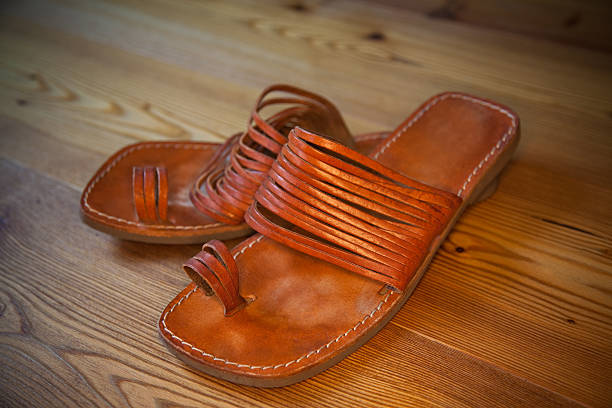 istock leather sandals on a wooden floor 109145574