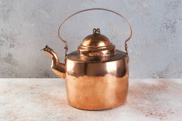 istock Vintage copper kettle on concrete background. 1091455926