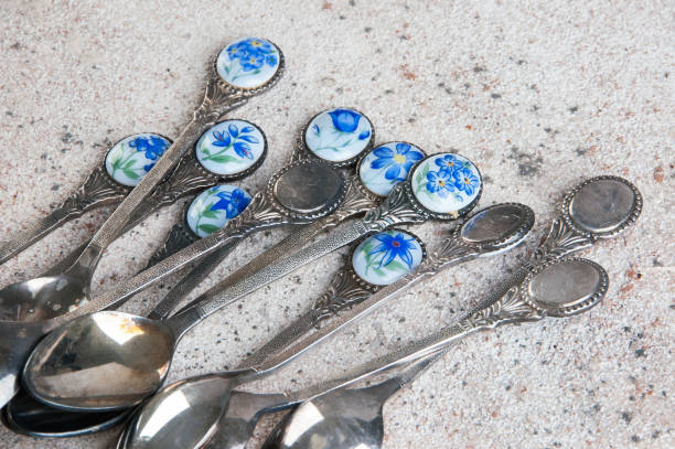 istock Vintage metal tea spoons on concrete background. 1091456580
