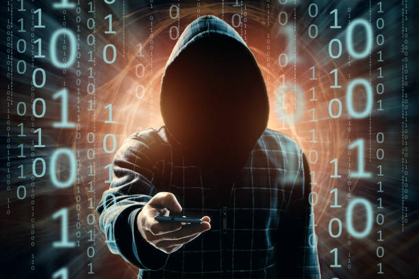 istock A young hacker in a hood hacks a smartphone, a hacker attack, a silhouette of a man, mixed media. The concept of a sudden attack, cryptography, data security, mobile Internet. 1091463228