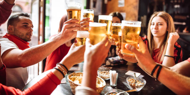 istock people talking and toasting in a pub with the beers 1091468962