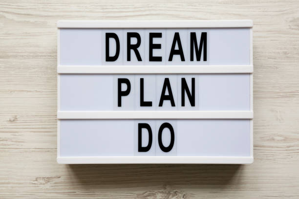 istock Lightbox with text 'Dream plan do' over white wooden background, top view. Business concept. From above, flat-lay, overhead. 1091469180