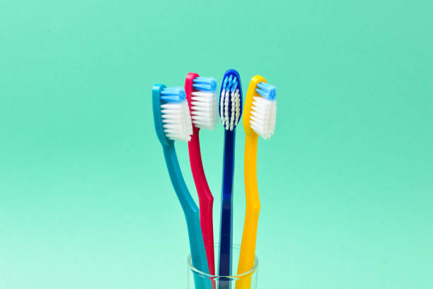 istock Toothbrushes on a green background. Space for text or design. 1091469210