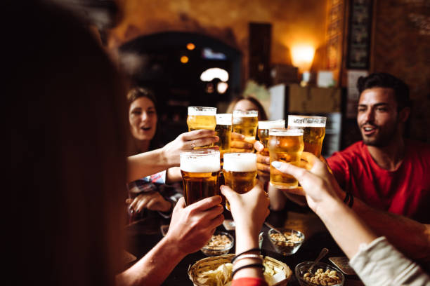 istock people talking and toasting in a pub with the beers 1091469644