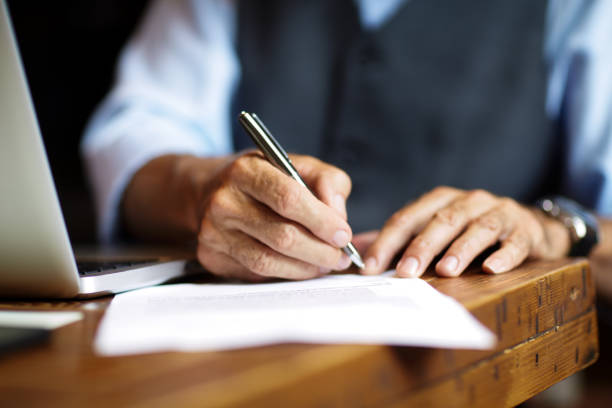 Signing a document stock photo