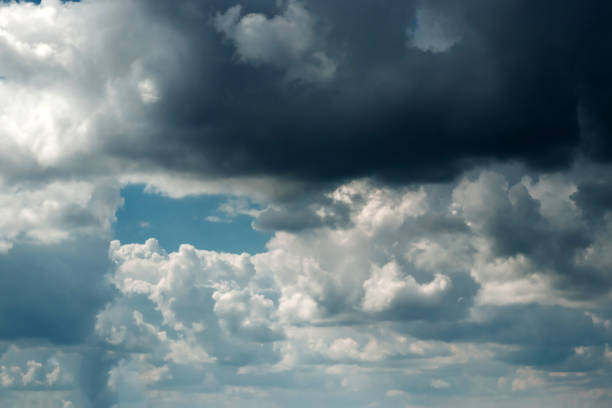 istock Fantastic, fluffy, white clouds against a blue sky. Rain clouds. The situation in the sky before the storm. copy space 1091474266
