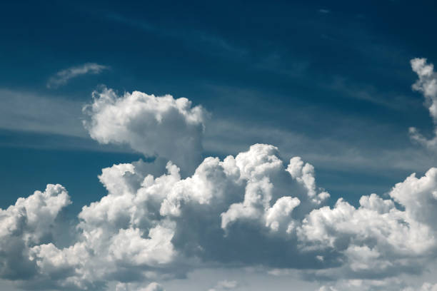 istock Fantastic, fluffy, white clouds against a blue sky. Rain clouds. The situation in the sky before the storm. copy space 1091474288