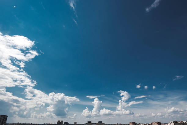 istock Fantastic, fluffy, white clouds against a blue sky. Rain clouds. The situation in the sky before the storm. copy space 1091474292