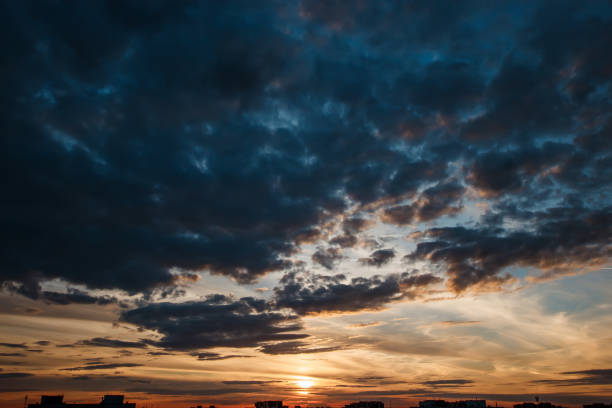 istock Creative background. Beautiful, atmospheric sunset in the sky. Red, yellow rays of the setting sun. copy space 1091474306