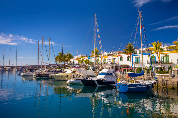 Marina of Puerto de Mogan, a small fishing port on Gran Canaria, Spain. Marina of Puerto de Mogan, a small fishing port on Gran Canaria, Spain. grand canary stock pictures, royalty-free photos & images