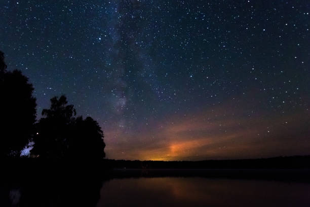 istock Starry sky, milky way, beautiful landscape, night time, Belarus. 1091475574